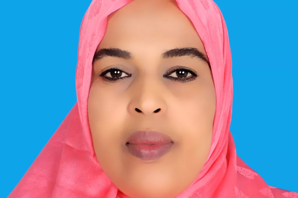 Portrait of Kaltun Sheikh Hassan in a red hijab.