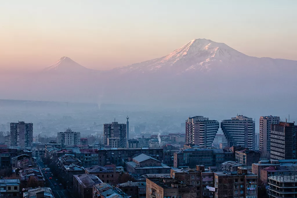 Armenia Yerevan buildings and a mountain covered in snow