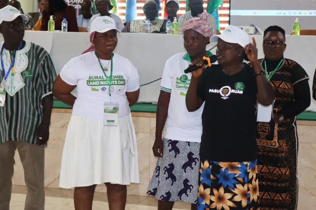 Woman speaking in a microphone at the conference