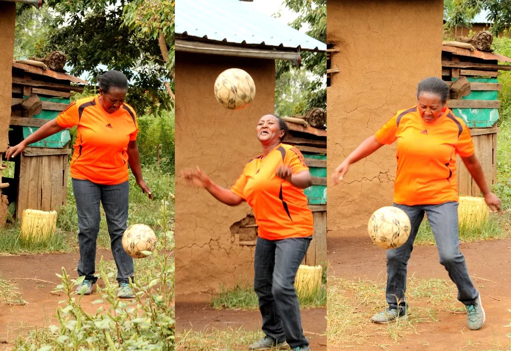 Salome Muthui, showcases her juggling skills at her compound in Visoi, Nakuru County