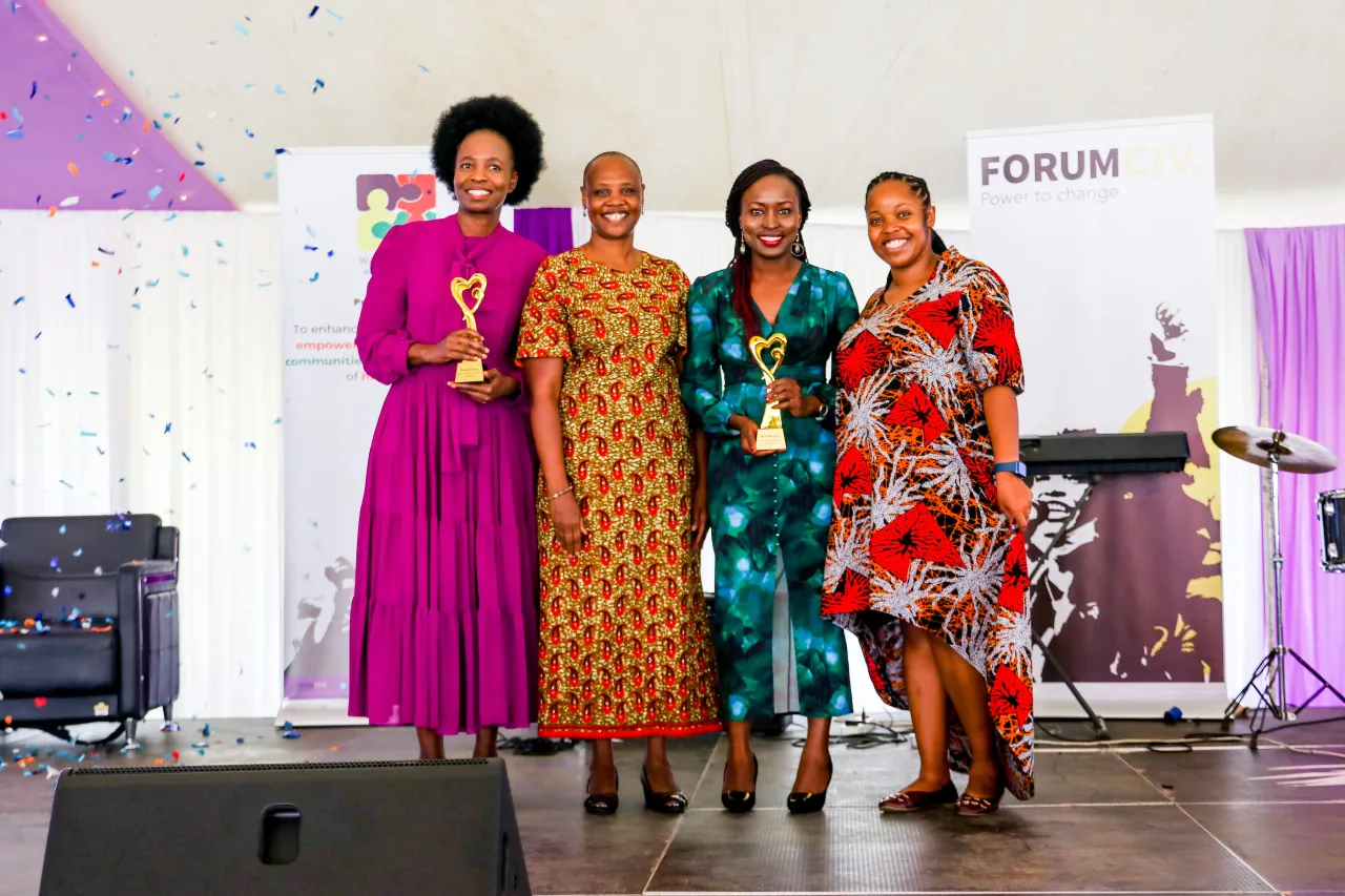 Women receiving a recognition award