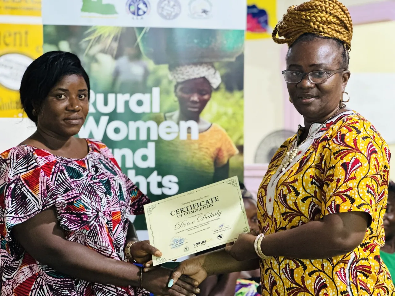 Woman receives a certificate om completed training