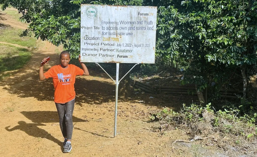 Ruth Boakai in orange t-shirt with the text 16 days of activism.